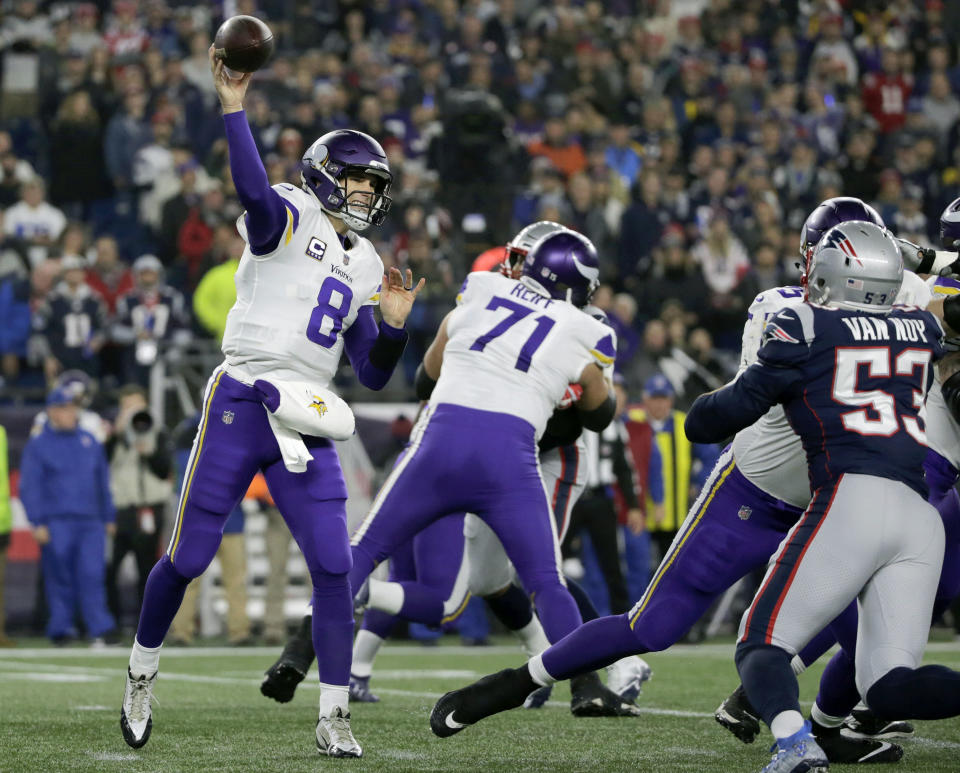 Minnesota Vikings quarterback Kirk Cousins (8) passes against the New England Patriots during the first half of an NFL football game, Sunday, Dec. 2, 2018, in Foxborough, Mass. (AP Photo/Elise Amendola)