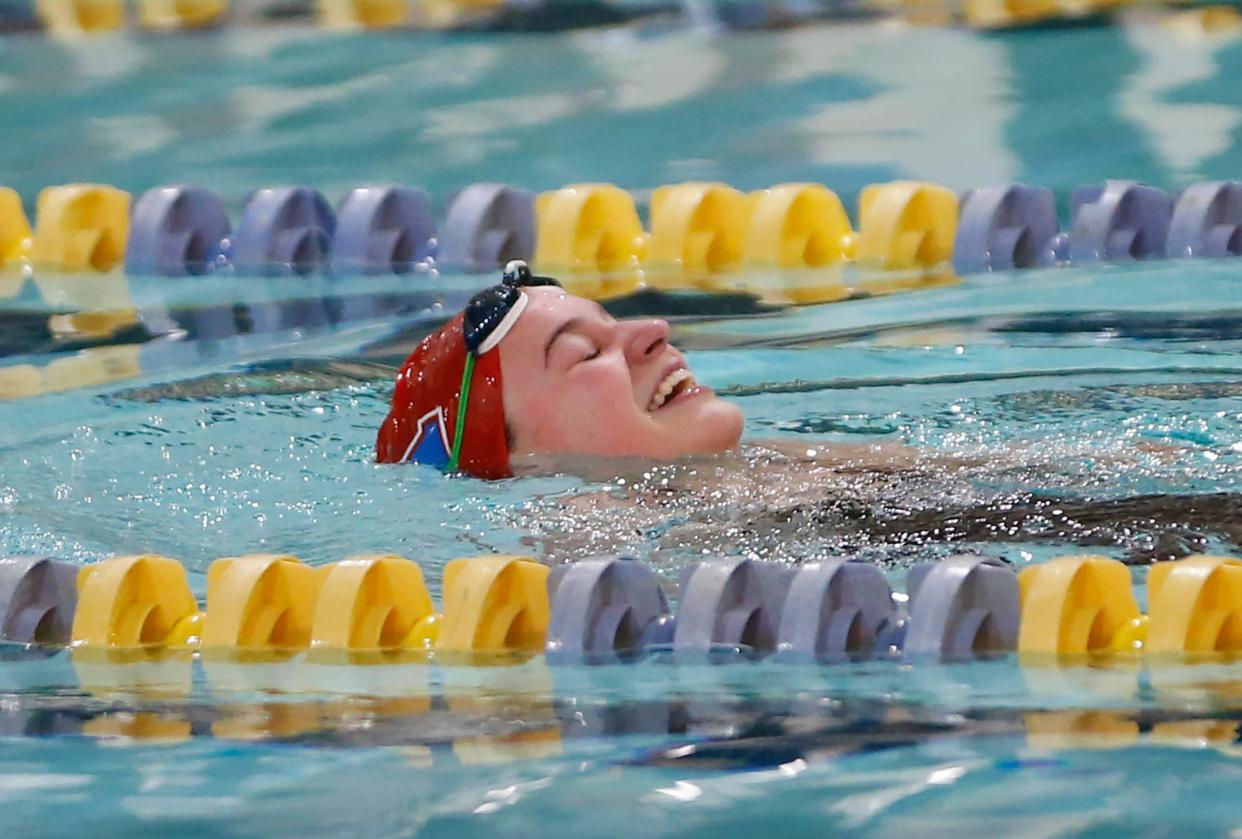 South Bend Adams sophomore Addy Szakaly smiles after winning the 200-yard individual medley race at the girls swimming sectional Saturday, Feb. 3, 2024, at Riley High School in South Bend.