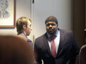 Former Dallas Cowboys NFL football player Josh Brent, right, stands with Dallas Cowboys linebacker Sean Lee in court after closing arguments in his intoxication manslaughter trial Tuesday, Jan. 21, 2014, in Dallas. The jury has begun deliberating in Brent's intoxication manslaughter trial after lawyers wrapped up their closing arguments Tuesday morning. Prosecutors accuse the former defensive tackle of drunkenly crashing his Mercedes near Dallas during a night out in December 2012, killing his good friend and teammate, Jerry Brown. (AP Photo/LM Otero)