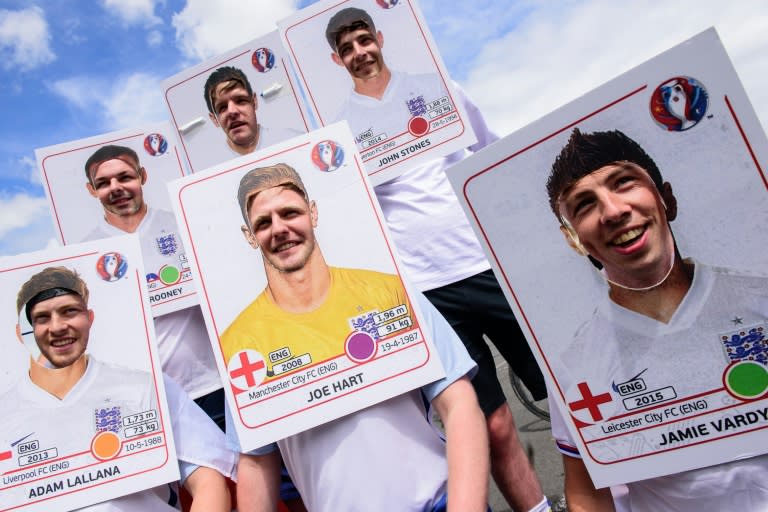 England fans dressed as football trading cards pose for a photo in central Lens, on June 16, 2016, before the Euro 2016 group match against Wales