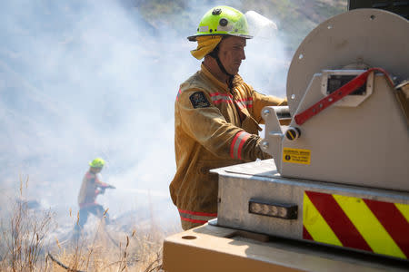 New Zealand Defence Force firefighters combat the Richmond fire near Nelson, South Island, New Zealand, February 8, 2019. Chad Sharman/New Zealand Defence Force/Handout via REUTERS