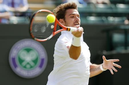 Stan Wawrinka of Switzerland hits a shot during his match against David Goffin of Belgium at the Wimbledon Tennis Championships in London, July 6, 2015. REUTERS/Suzanne Plunkett