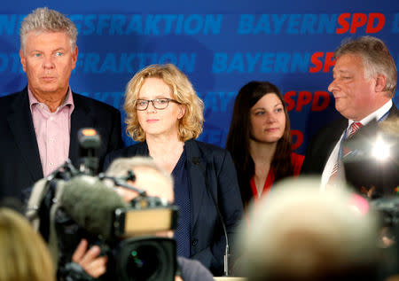 Natascha Kohnen, top candidate of the Social Democratic Party (SPD) and Dieter Reiter, Munich's mayor react after first exit polls in the Bavarian state election in Munich, Germany, October 14, 2018. REUTERS/Michaela Rehle