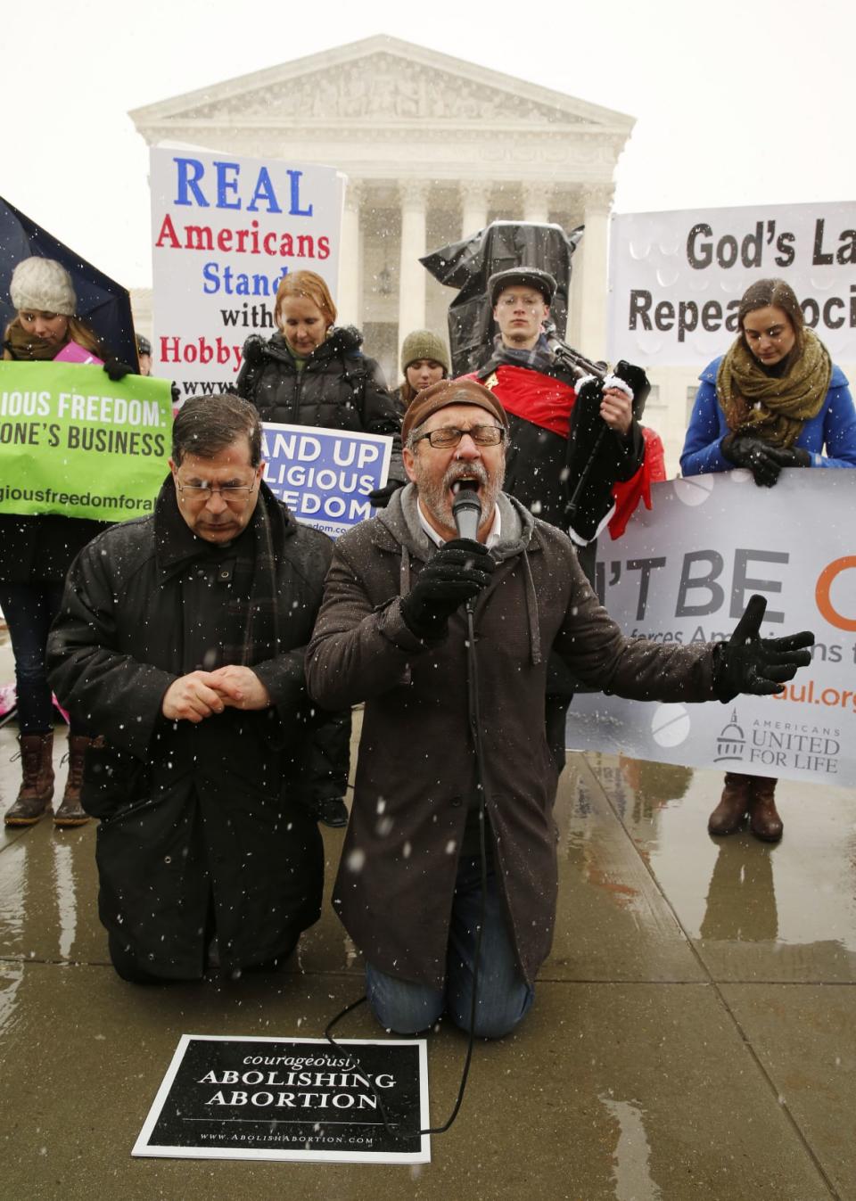 <div class="inline-image__caption"><p>Father Frank Pavone (L) and Reverend Patrick Mahoney pray at the steps of the Supreme Court in 2014 as arguments begin to challenge the Affordable Care Act’s requirement that employers provide coverage for contraception.</p></div> <div class="inline-image__credit">Reuters</div>