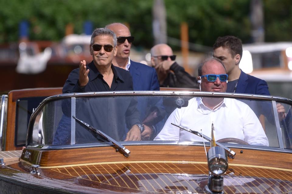 Clooney,  on a taxi-boat during the Venice Film Festival, spends much of his time with wife Amal and their twins at their sprawling estate on Italy’s Lake Como (Filippo Monteforte/AFP via Getty Images)