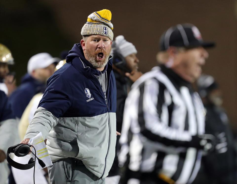 Hoban football coach Tim Tyrrell reacts after a first-half interception against Massillon during an OHSAA Division II state semifinal, Friday, Nov. 25, 2022, in Akron.