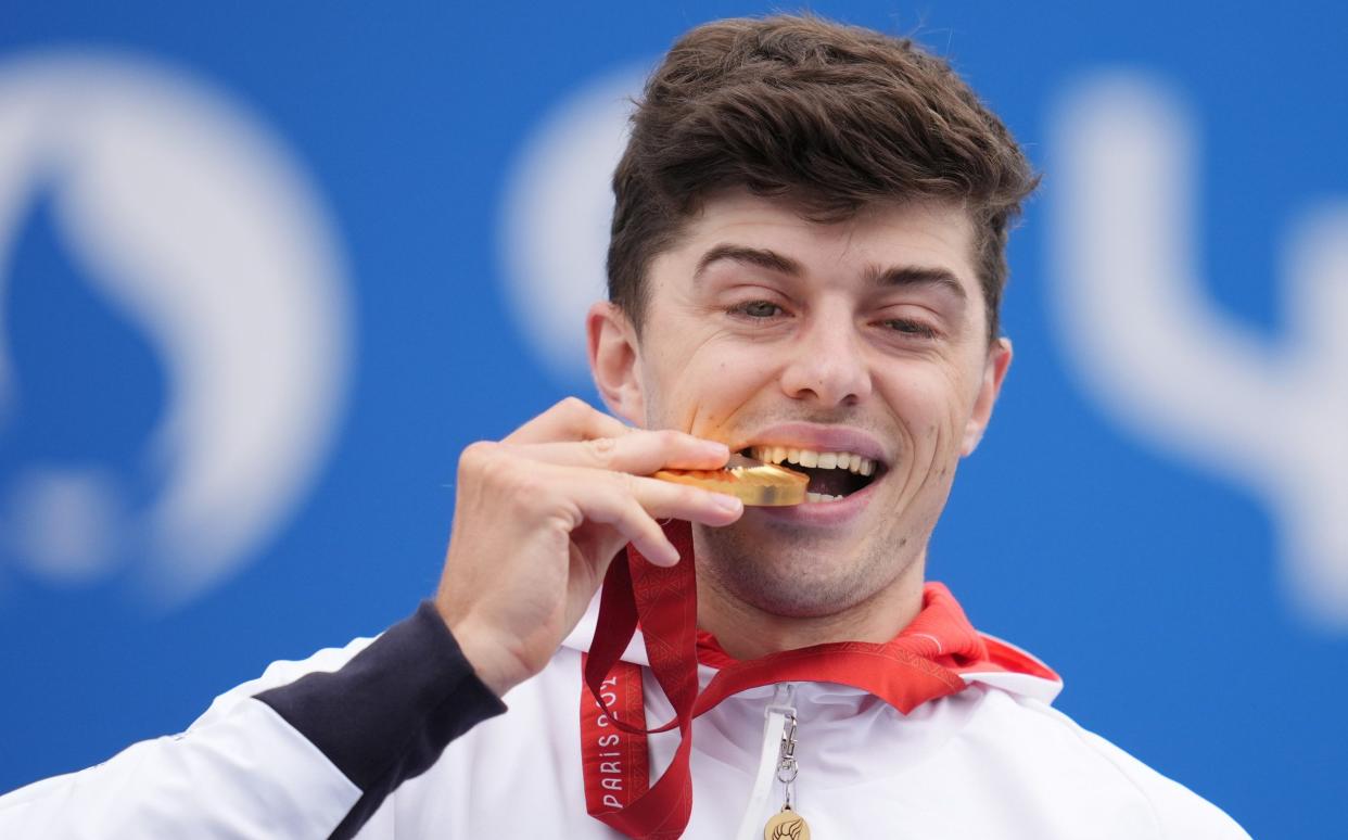 Great Britain's Finlay Graham celebrates with his Gold medal after winning the Men's C1-3 Road Race at the Cilchy-sous-bois on day Ten of the Paris 2024 Summer Paralympic Games. Picture date: Saturday September 7, 2024