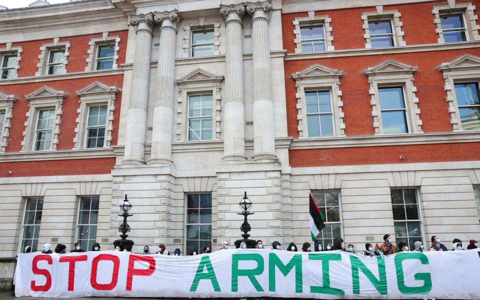 Demonstrators protest outside the Department for Business and Trade