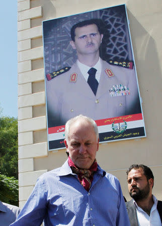 FILE PHOTO: Ake Sellstrom (C), the head of a United Nations (U.N.) chemical weapons investigation team, stands outside Yousef al-Azma military hospital in Damascus, Syria August 30, 2013. REUTERS/Khaled al-Hariri/File Photo