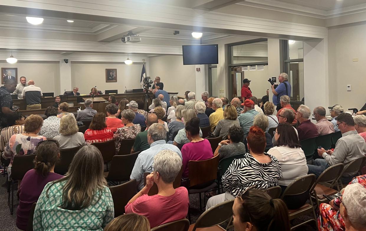 Attendees gather for a public hearing on the Republican challenge to a special election petition for Warren County in Indianola, Iowa on June 30, 2023.