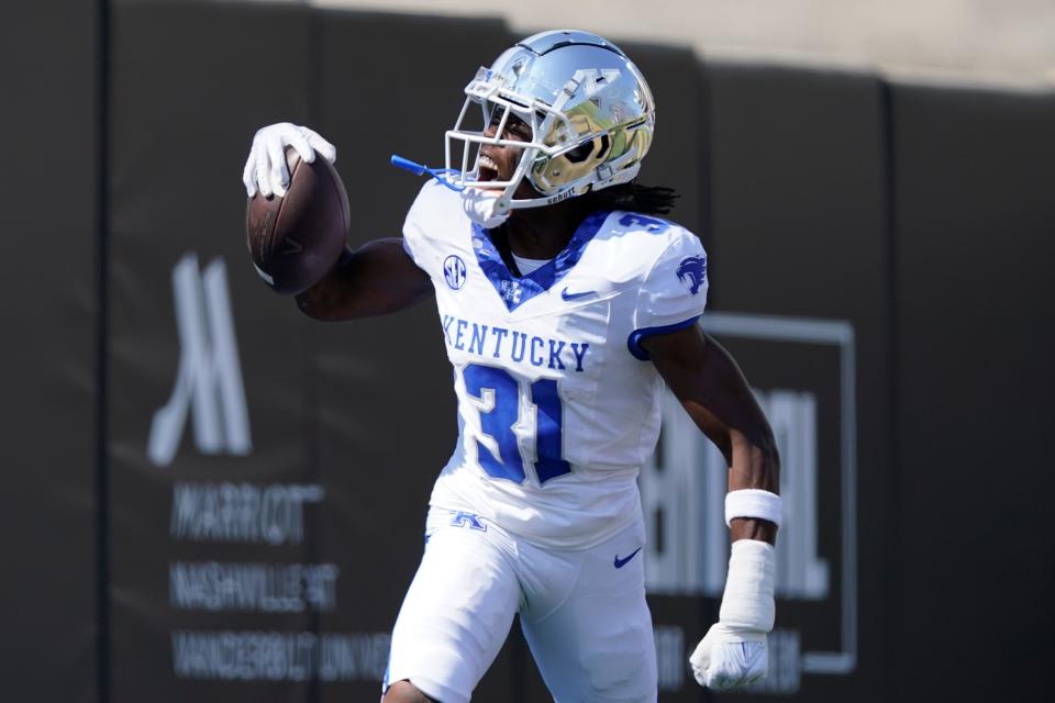 Kentucky defensive back Maxwell Hairston (31) celebrates his interception for a touchdown against Vanderbilt in the first half of an NCAA college football game Sept. 23, 2023, in Nashville, Tenn.