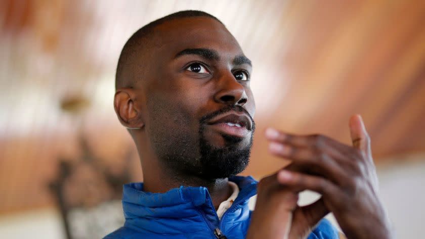 FILE â€“ In this March 26, 2016, file photo, Black Lives Matter activist DeRay Mckesson, chatting with campaign volunteers in Baltimore. A federal lawsuit accuses Black Lives Matter and several movement leaders of inciting violence that led to a gunman's deadly ambush of law enforcement officers in Baton Rouge last summer. Mckesson and four other Black Lives Matter leaders are named as defendants in the suit filed Friday on behalf of one of the officers wounded in the July 17 attack by a black military veteran, who killed three other officers before he was shot dead. (AP Photo/Patrick Semansky, File)