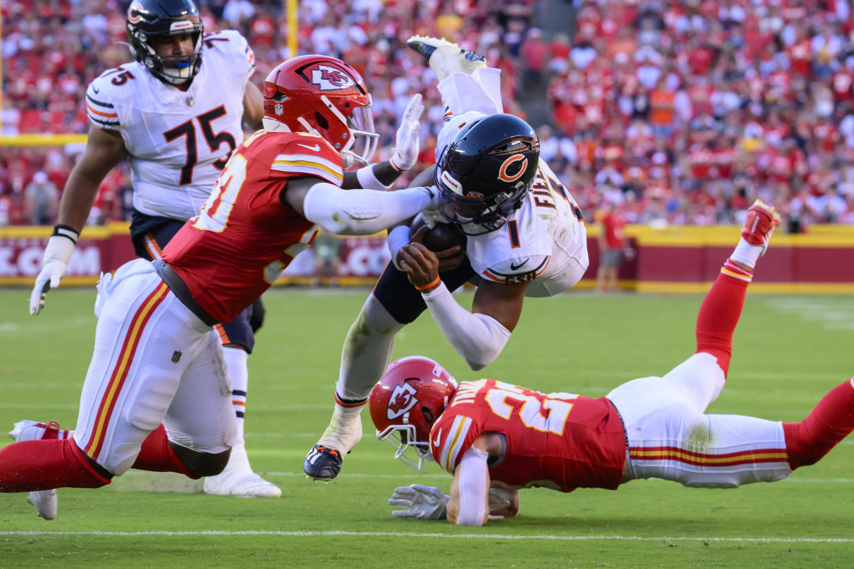 Justin Fields returned to Sunday's game after a blow to the head from Chiefs linebacker Willie Gay. (AP Photo/Reed Hoffmann)