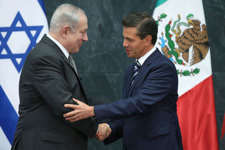 Israeli Prime Minister Benjamin Netanyahu speaks with Mexico's President Enrique Pena Nieto during an address to the media at Los Pinos presidential residence in Mexico City, Mexico, September 14, 2017. REUTERS/Edgard Garrido