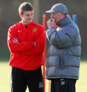 FILE PHOTO: Football Soccer - Manchester United Training - Carrington training complex, Manchester, Britain - November 6, 2007 Manchester United manager Alex Ferguson (R) and Ole Gunnar Solskjaer talk during training REUTERS/Phil Noble / File Photo