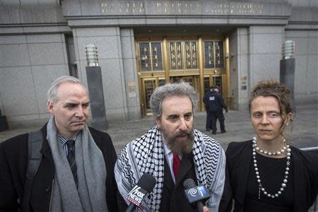 Suleiman Abu Ghaith's defense attorney Stanley Cohen (C) speak to the press outside the Manhattan Federal Court house in New York, March 24, 2014. REUTERS/Brendan McDermid