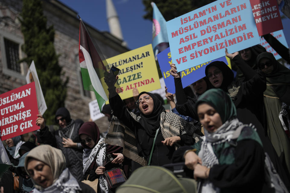 Supporters of Palestinians in Gaza protest in Istanbul, Turkey, Friday, April 5, 2024. (AP Photo/Khalil Hamra)