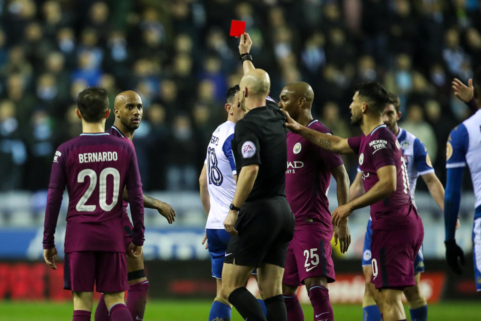 Fabian Delph was shown a late-first-half red card, and Manchester City went on to lose in the FA Cup to Wigan. (Getty)