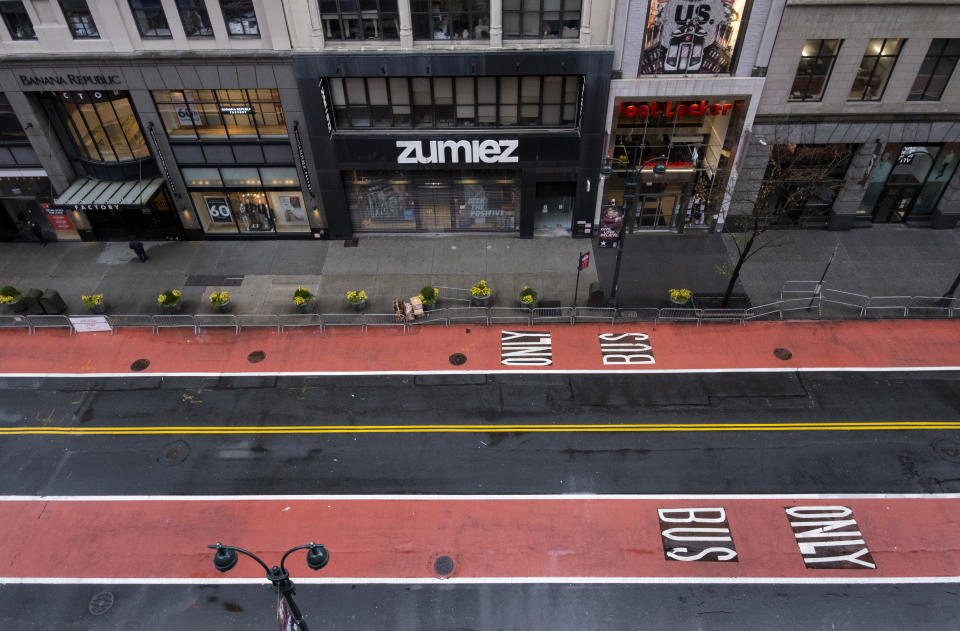 West 34th Street is blocked to pedestrians and traffic as the Macy's Thanksgiving Day Parade is underway about a block west in New York, Thursday, Nov. 26, 2020. Due to the pandemic, crowds of onlookers were not allowed to attend the annual parade. (AP Photo/Craig Ruttle)