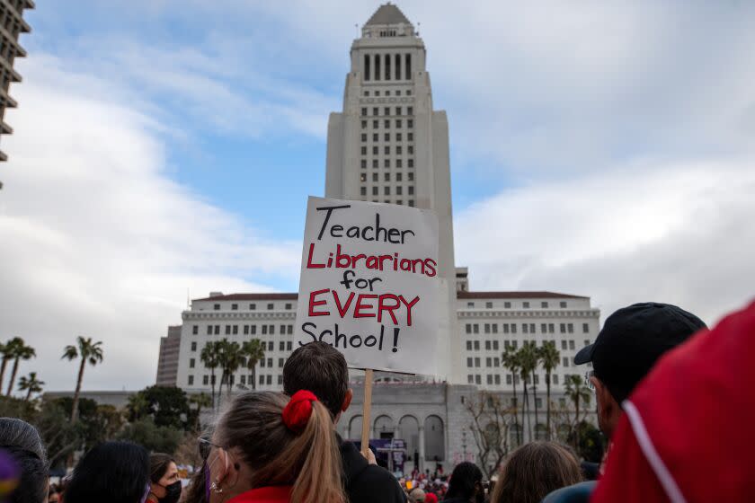 Los Angeles, CA - March 15: A crowd gathered in Grand Park infant of City Hall on Wednesday, March 15, 2023, in Los Angeles, CA. United Teachers of Los Angeles and SEIU 99 members hold a joint rally at Grand Park in a historic show of solidarity. It has been almost ten months since the contract between LAUSD and UTLA has expired, and a staggering three years for SEIU members, leaving almost 60,000 employees vulnerable in the midst of a record-high inflation and a housing crisis. (Francine Orr / Los Angeles Times)