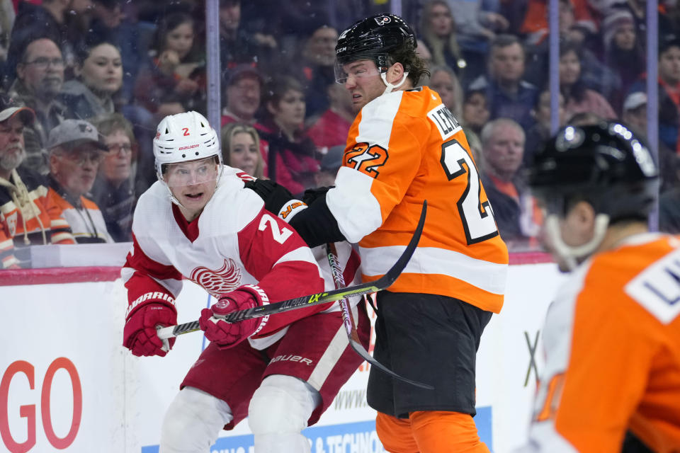 Philadelphia Flyers' Brendan Lemieux (22) collides with Detroit Red Wings' Olli Maatta (2) during the second period of an NHL hockey game, Sunday, March 5, 2023, in Philadelphia. (AP Photo/Matt Slocum)