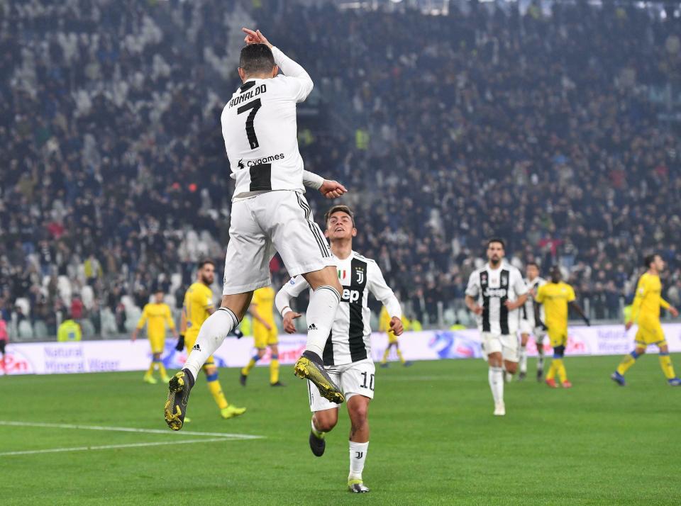 Juventus' Cristiano Ronaldo, left, celebrates with his teammate Paulo Dybala after scoring during the Serie A soccer match between Juventus and Frosinone at the Allianz Stadium in Turin, Italy, Friday, Feb. 15, 2019. (Alessandro Di Marco/ANSA via AP)