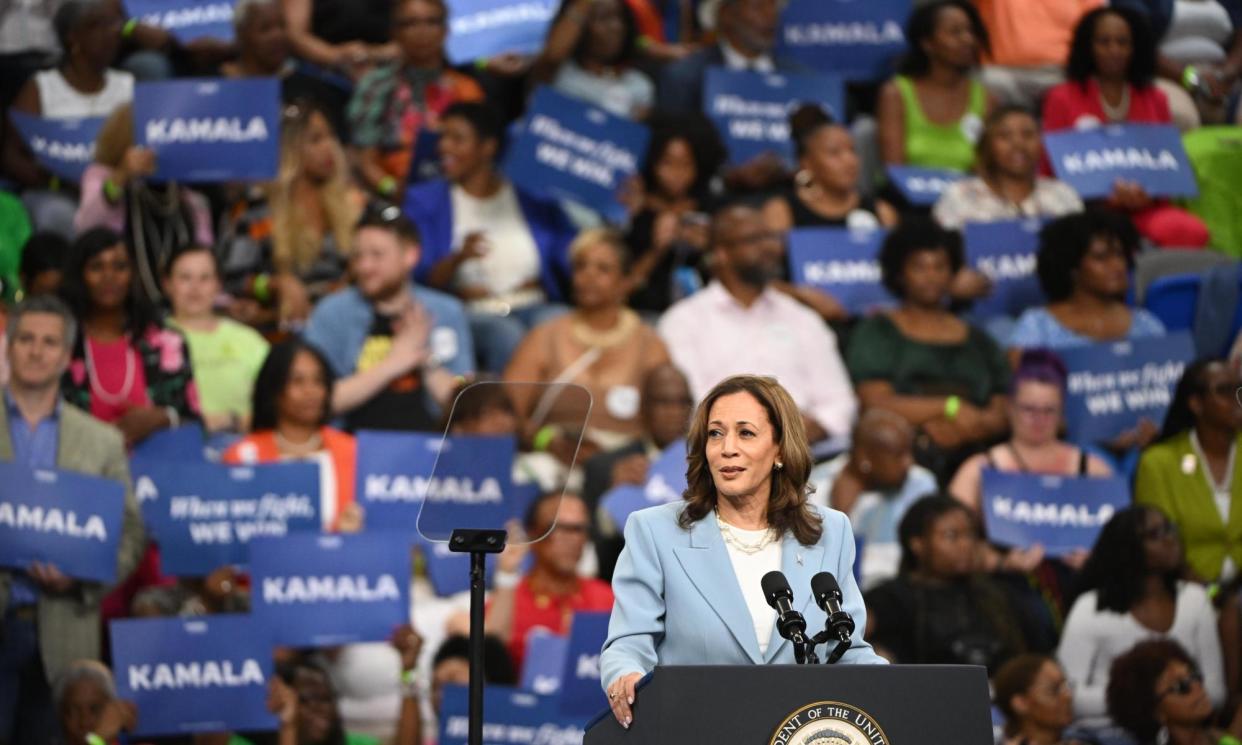 <span>Kamala Harris speaks at a rally in Atlanta on Tuesday night.</span><span>Photograph: Edward M Pio Roda/EPA</span>