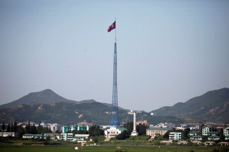 A North Korean flag flutters on top of a tower at the propaganda village of Gijungdong in North Korea, in this picture taken near the truce village of Panmunjom, South Korea, August 26, 2017. REUTERS/Kim Hong-Ji/Files