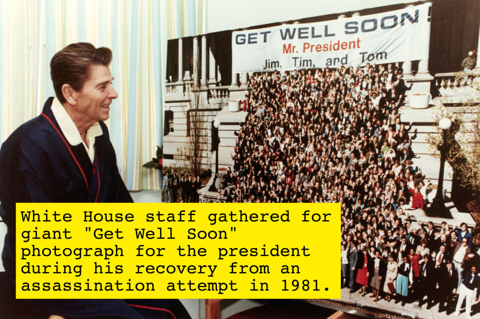 Ronald Reagan, seated, looks at a "Get Well Soon, Mr. President" banner with a large crowd photo including names Jim, Tim, and Tom. Reagan is wearing a robe