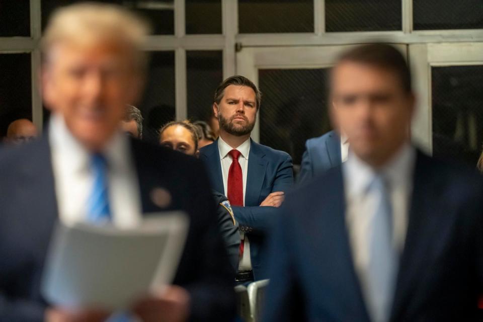 Sen. JD Vance (R-OH) looks on as former President Donald Trump speaks to the media during Trump’s trial for allegedly covering up hush money payments. (Getty Images)