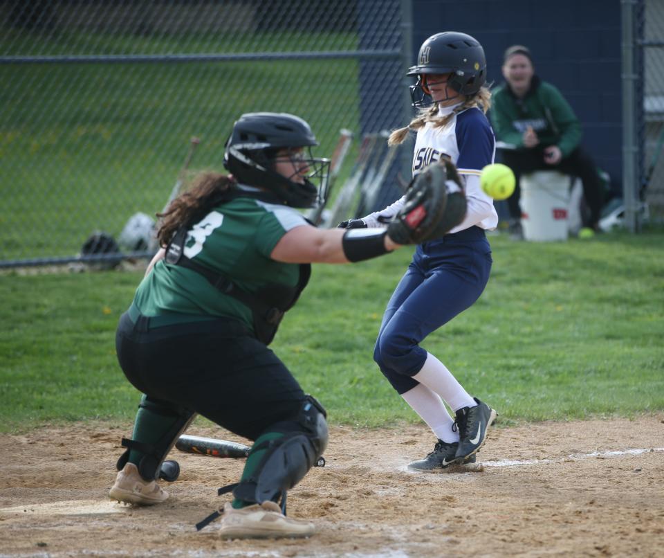 Spackenkill's Adriana Alessandro receives a throw to home plate and attempts to tag Highland's McKenzie Brooker during an April 19, 2023 softball game.