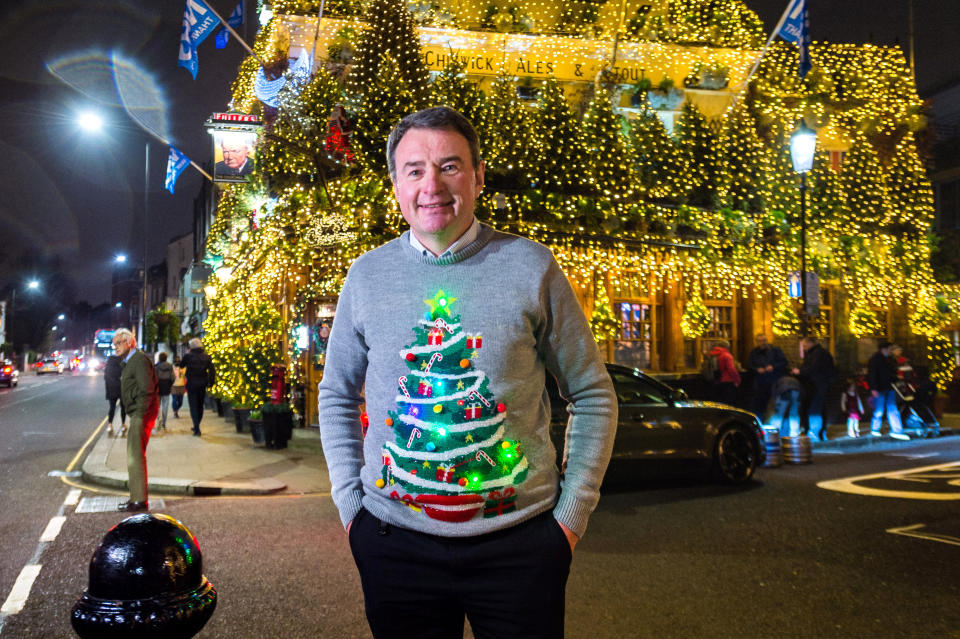 LONDON, ENGLAND - DECEMBER 02:  General Manager, James Keogh of The Churchill Arms poses outside his pub after turning on their 2020 Christmas lights on December 2, 2020 in London, England. Many Christmas events have been cancelled this year due to the Coronavirus Pandemic but London is festooned with Christmas Lights across the capital.  (Photo by Joseph Okpako/Getty Images)