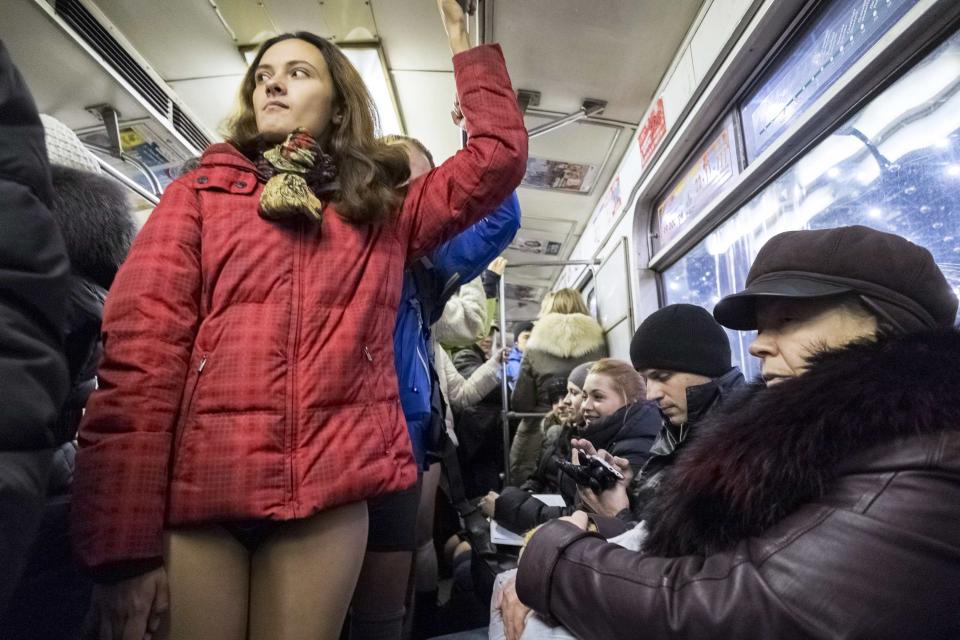 A passenger without pants rides a subway train during the "No Pants Subway Ride" in Kiev