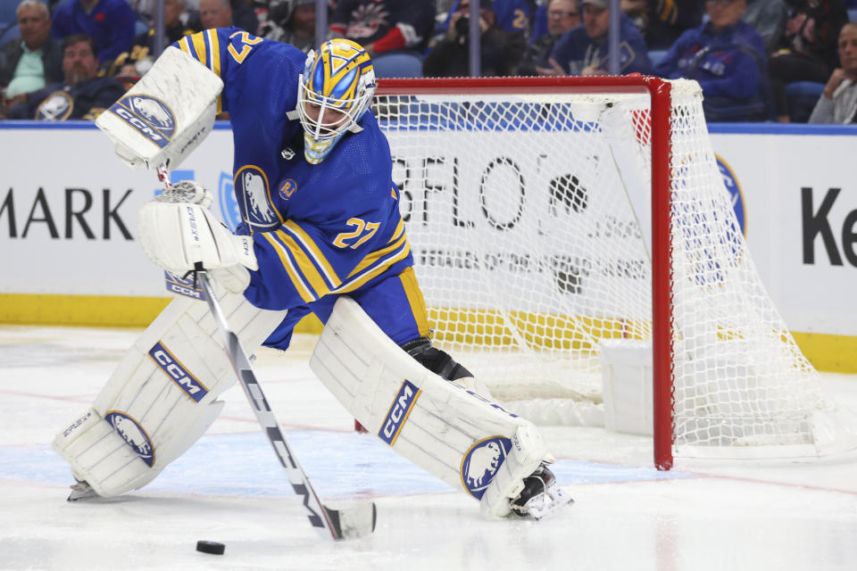 Buffalo Sabres goaltender Devon Levi (27) plays the puck during the second period of an NHL hockey game against the New York Rangers, Thursday, Oct, 12, 2023, in Buffalo, N.Y. (AP Photo/Jeffrey T. Barnes)