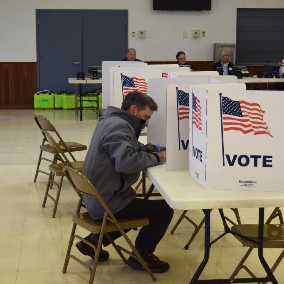 Richard DeMarco votes at the Holmes County Catholic Center on Tuesday in Millersburg, where poll workers said turnout was light throughout the morning.