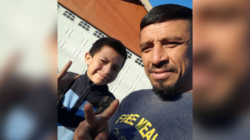 Manuel Cordova poses in a recent photo with his son Eythan, 12. Cordova, who now has seven children and four grandchildren, says he thought of his own children when he came across Chris Buchleitner in the Arizona wilderness. - Courtesy Manuel Cordova