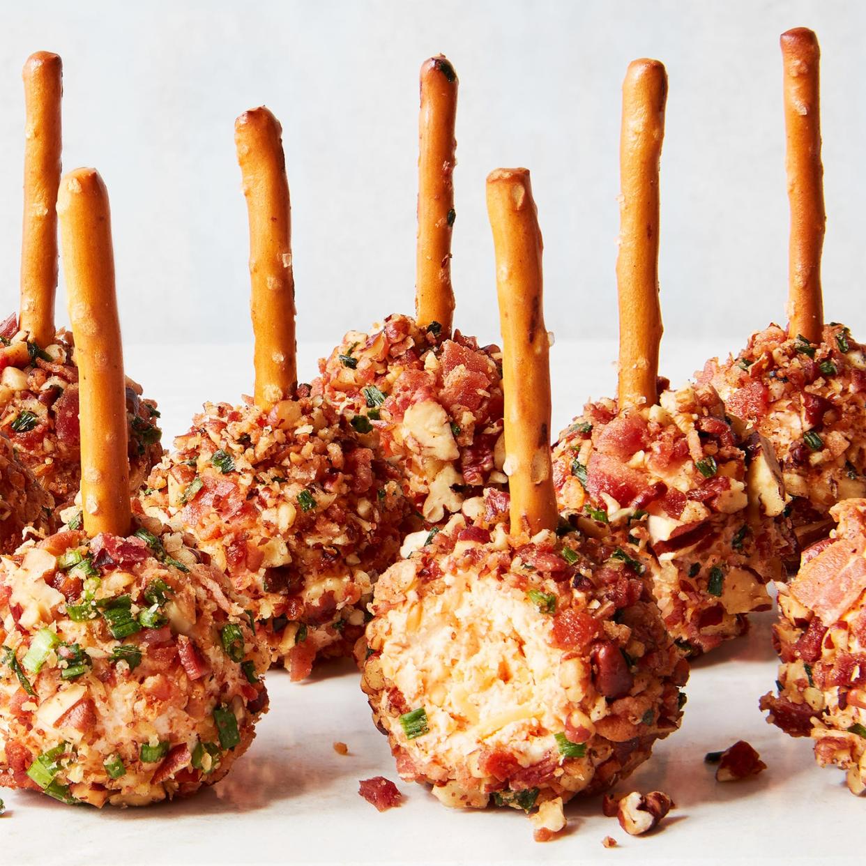 cheese ball bites with pretzel sticks