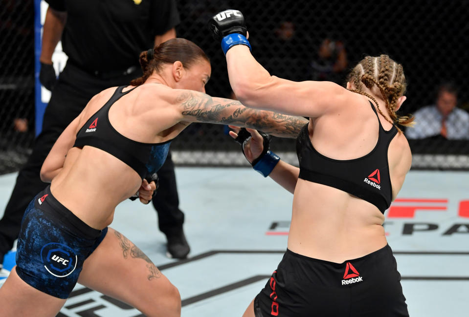 SACRAMENTO, CALIFORNIA - JULY 13:  (L-R) Germaine de Randamie of the Netherlands punches Aspen Ladd in their women's bantamweight bout during the UFC Fight Night event at Golden 1 Center on July 13, 2019 in Sacramento, California. (Photo by Jeff Bottari/Zuffa LLC/Zuffa LLC via Getty Images)