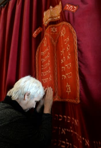 Fanny Mergui, a Moroccan Jewish woman, meditates as she visits Casablanca's Moroccan Jewish museum on March 6, 2015