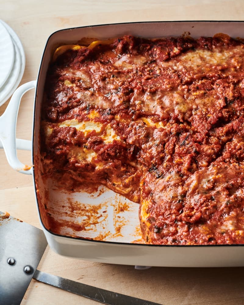 Ina Garten's turkey lasagna in baking dish with slice served out.