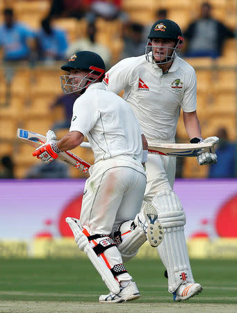 Cricket - India v Australia - Second Test cricket match - M Chinnaswamy Stadium, Bengaluru, India - 04/03/17. Australia's David Warner and Matt Renshaw run between the wickets. REUTERS/Danish Siddiqui