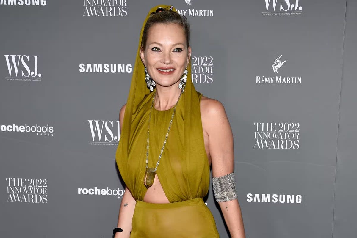 Kate Moss stunned in a sheer olive-hued dress on the red carpet  (Evan Agostini/Invision/AP)