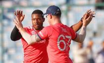 Cricket - England v Afghanistan - World Twenty20 cricket tournament - New Delhi, India, 23/03/2016. England's Chris Jordan (L) celebrates with his teammate Jason Roy after taking the wicket of Afghanistan's captain Asghar Stanikzai. REUTERS/Adnan Abidi