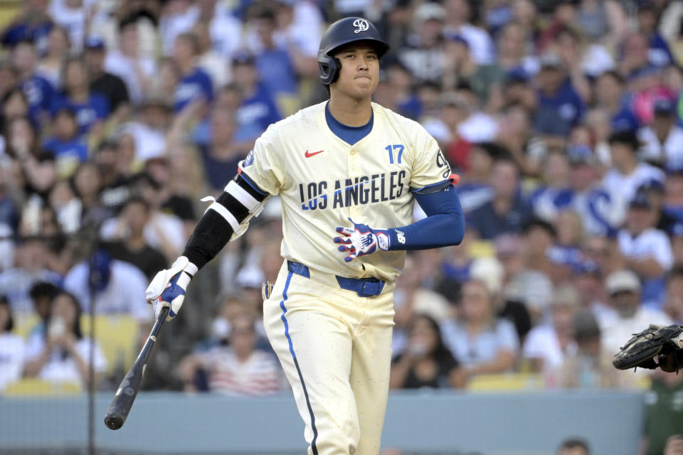 Los Angeles Dodgers' Shohei Ohtani reacts after striking out in the third inning against the Pittsburgh Pirates during a baseball game Saturday, Aug. 10, 2024, in Los Angeles. (AP Photo/Jayne-Kamin-Oncea)