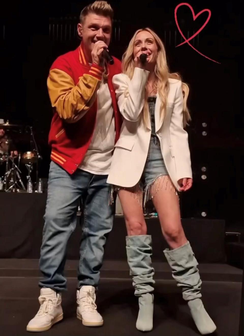 Former Backstreet Boy Nick Carter and 'The Bachelor' franchise star Carly Waddell sing together Oct. 7, 2023, at the Schermerhorn Symphony Center in Nashville at a Carter concert there that night. Waddell, an aspiring singer/songwriter in Nashville now, says she'll open all Carter's dates this year