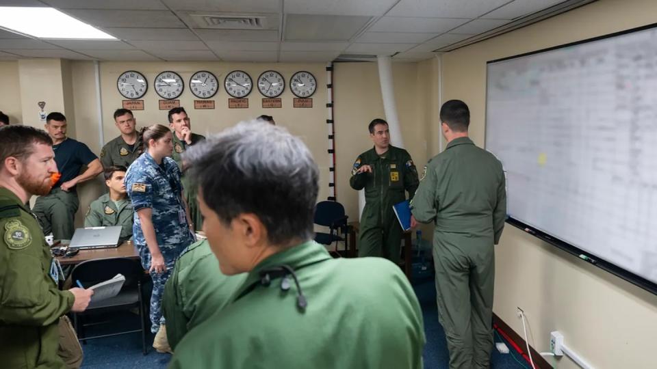 Troops from Australia, Canada, France, Japan, New Zealand and the U.S. conduct mission planning during Mobility Guardian 23 at Andersen Air Force Base, Guam, July 9. Portions of this image were blurred for security reasons. (Tech. Sgt. Joseph Pick/Air Force)