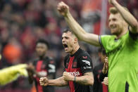 Leverkusen's Granit Xhaka celebrates after winning the German Bundesliga soccer match between Bayer Leverkusen and TSG Hoffenheim at the BayArena in Leverkusen, Germany, Saturday, March 30, 2024. (AP Photo/Martin Meissner)