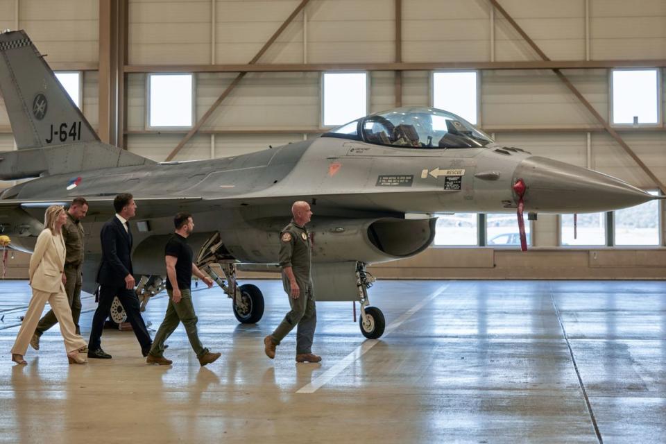 President Volodymyr Zelensky and Dutch Prime Minister Mark Rutte tour of a hanger containing F-16 fighter jets ahead of a news conference at an airbase near Eindhoven, Netherlands, on Aug. 20, 2023. (Ksenia Kuleshova/Bloomberg via Getty Images)