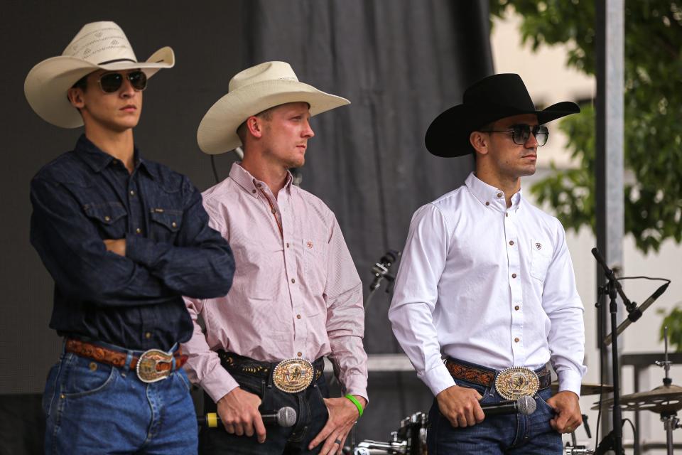 Jose Vitor Leme, right, joined by fellow bull riders Dalton Kasel, left, and Cooper Davis, was taken by the Austin Gamblers as the first pick of the Professional Bull Riders team draft Monday. He is a two-time world champion.