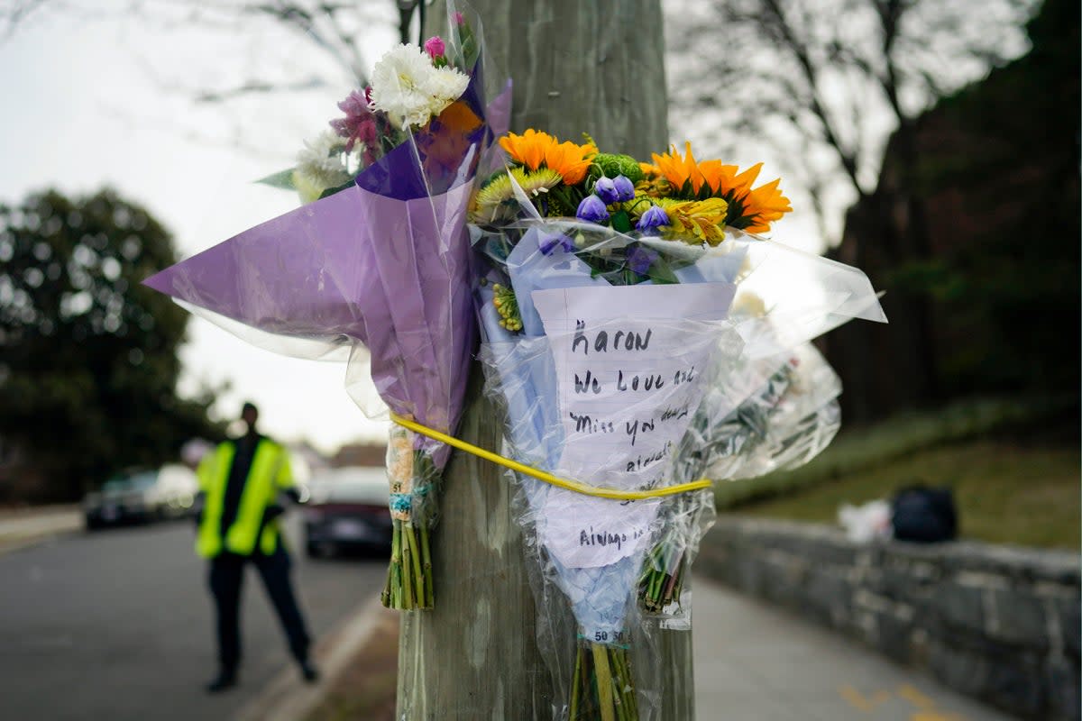 Flowers are placed in a DC neighbourhood where 13-year-old Karon Blake was fatally shot (Copyright 2023 The Associated Press. All rights reserved)
